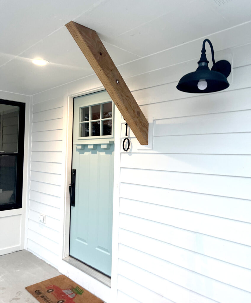 New exterior entry door, also added electric, fixed siding and drywall.